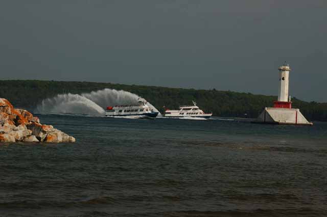 hydro-jets cruise past the Straits' lighthouses